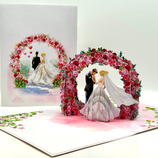 Blonde - Meridian Pink & Red Rose Arch with Bride & Groom Created by Origami Pop Cards – 3D Pop Up Greeting Cards, Australian Design & Handmade, 3D Pop Up Magical Paper Cards, Handmade Pop Up Cards Celebrate Love Anniversary Heart Fell and Romantic