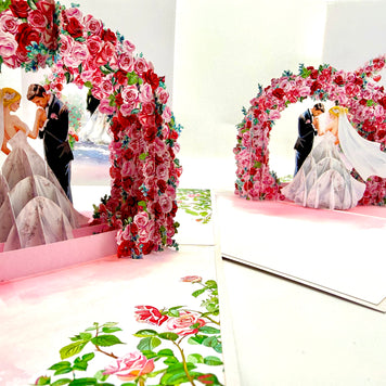 Blonde - Meridian Pink & Red Rose Arch with Bride & Groom Created by Origami Pop Cards – 3D Pop Up Greeting Cards, Australian Design & Handmade, 3D Pop Up Magical Paper Cards, Handmade Pop Up Cards Celebrate Love Anniversary Heart Fell and Romantic