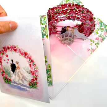 Brunette - Meridian Pink & Red Rose Arch with Bride & Groom Created by Origami Pop Cards – 3D Pop Up Greeting Cards, Australian Design & Handmade, 3D Pop Up Magical Paper Cards, Handmade Pop Up Cards Celebrate Love Anniversary Heart Fell and Romantic