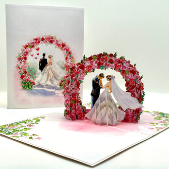 Brunette - Meridian Pink & Red Rose Arch with Bride & Groom Created by Origami Pop Cards – 3D Pop Up Greeting Cards, Australian Design & Handmade, 3D Pop Up Magical Paper Cards, Handmade Pop Up Cards Celebrate Love Anniversary Heart Fell and Romantic