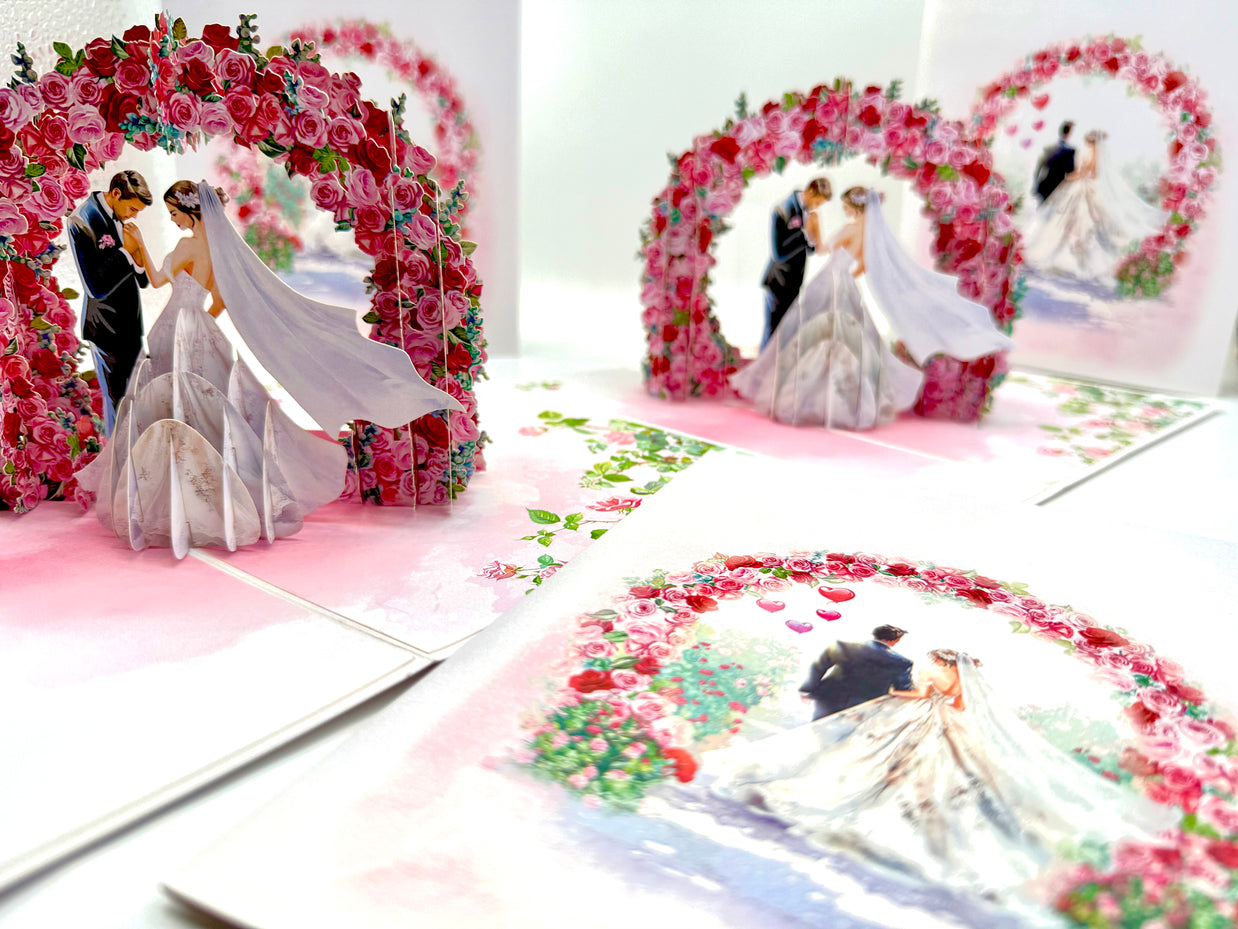 Brunette - Meridian Pink & Red Rose Arch with Bride & Groom Created by Origami Pop Cards – 3D Pop Up Greeting Cards, Australian Design & Handmade, 3D Pop Up Magical Paper Cards, Handmade Pop Up Cards Celebrate Love Anniversary Heart Fell and Romantic