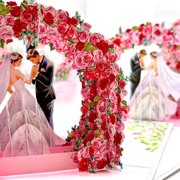 Brunette - Meridian Pink & Red Rose Arch with Bride & Groom Created by Origami Pop Cards – 3D Pop Up Greeting Cards, Australian Design & Handmade, 3D Pop Up Magical Paper Cards, Handmade Pop Up Cards Celebrate Love Anniversary Heart Fell and Romantic