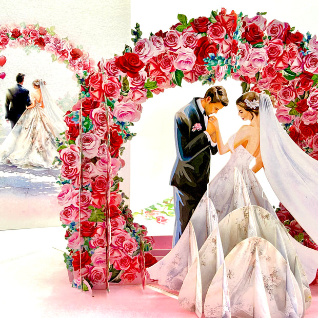 Brunette - Meridian Pink & Red Rose Arch with Bride & Groom Created by Origami Pop Cards – 3D Pop Up Greeting Cards, Australian Design & Handmade, 3D Pop Up Magical Paper Cards, Handmade Pop Up Cards Celebrate Love Anniversary Heart Fell and Romantic