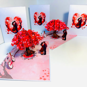 Couple in Love under a Hot Pink Love Heart Cherry Blossom Tree 3D POP UP GREETING CARD - Created by Origami Pop Cards Australian Design & Handmade 3D Pop Up Magical Paper Cards, Handmade Pop Up Cards Celebrate Love Anniversary Heart Fell and Romantic