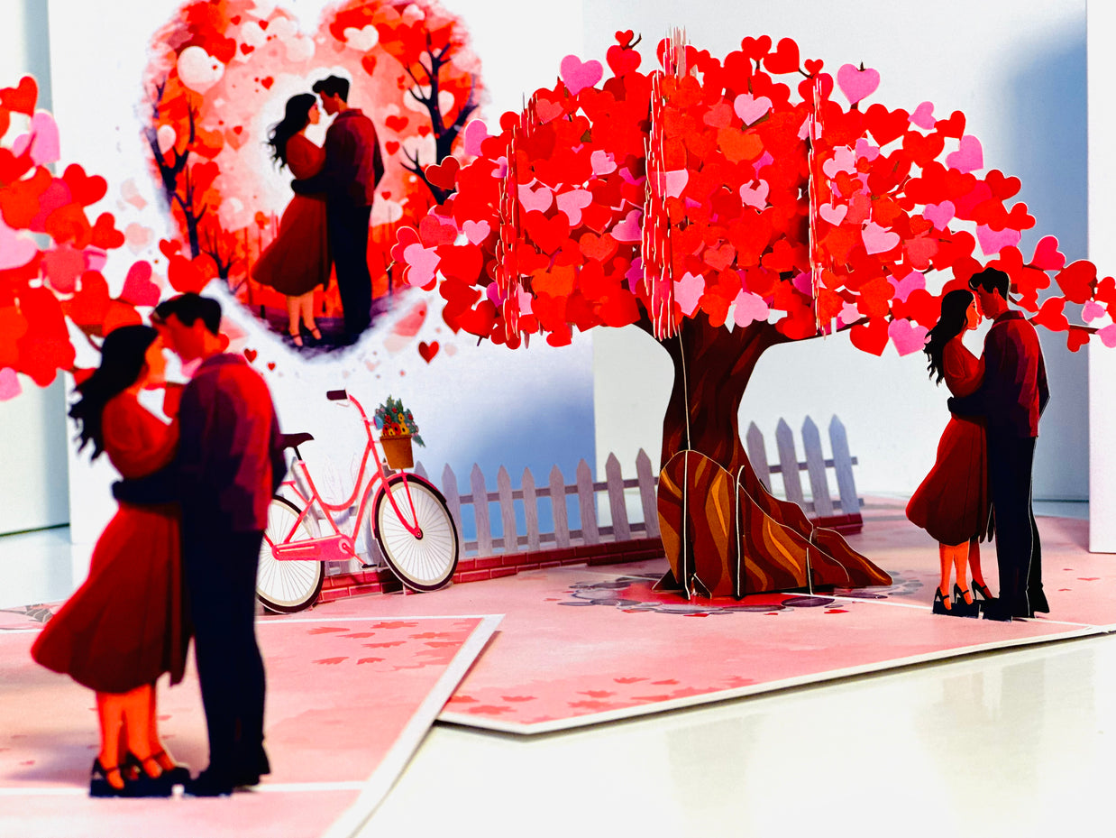 Couple in Love under a Hot Pink Love Heart Cherry Blossom Tree 3D POP UP GREETING CARD - Created by Origami Pop Cards Australian Design & Handmade 3D Pop Up Magical Paper Cards, Handmade Pop Up Cards Celebrate Love Anniversary Heart Fell and Romantic