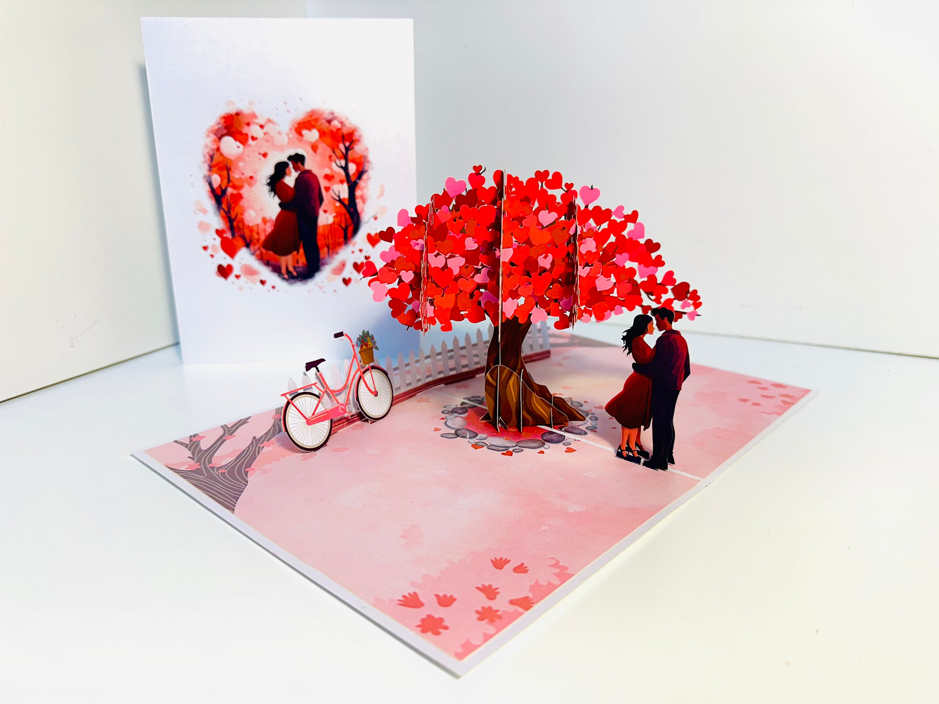 Couple in Love under a Hot Pink Love Heart Cherry Blossom Tree 3D POP UP GREETING CARD - Created by Origami Pop Cards Australian Design & Handmade 3D Pop Up Magical Paper Cards, Handmade Pop Up Cards Celebrate Love Anniversary Heart Fell and Romantic