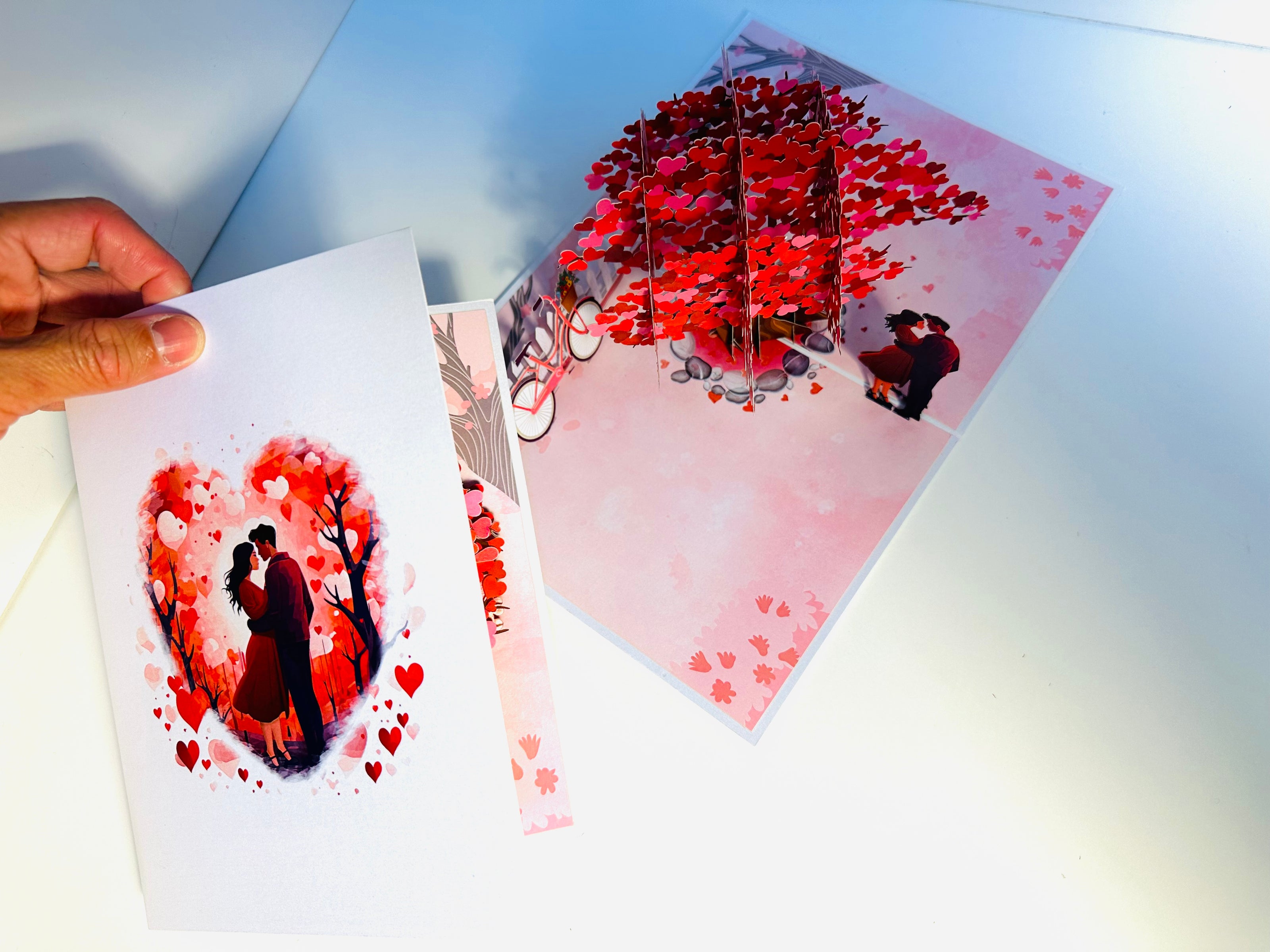 Couple in Love under a Hot Pink Love Heart Cherry Blossom Tree 3D POP UP GREETING CARD - Created by Origami Pop Cards Australian Design & Handmade 3D Pop Up Magical Paper Cards, Handmade Pop Up Cards Celebrate Love Anniversary Heart Fell and Romantic