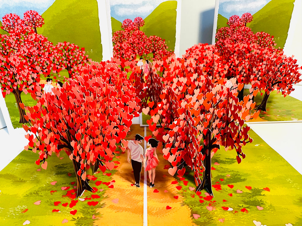 Love Heart Cherry Blossom Forest with a Couple in Love 3D POP UP GREETING CARD - Created by Origami Pop Cards Australian Design & Handmade 3D Pop Up Magical Paper Cards, Handmade Pop Up Cards Happy Valentine's Day Celebrate Love Heart Fell and Romantic