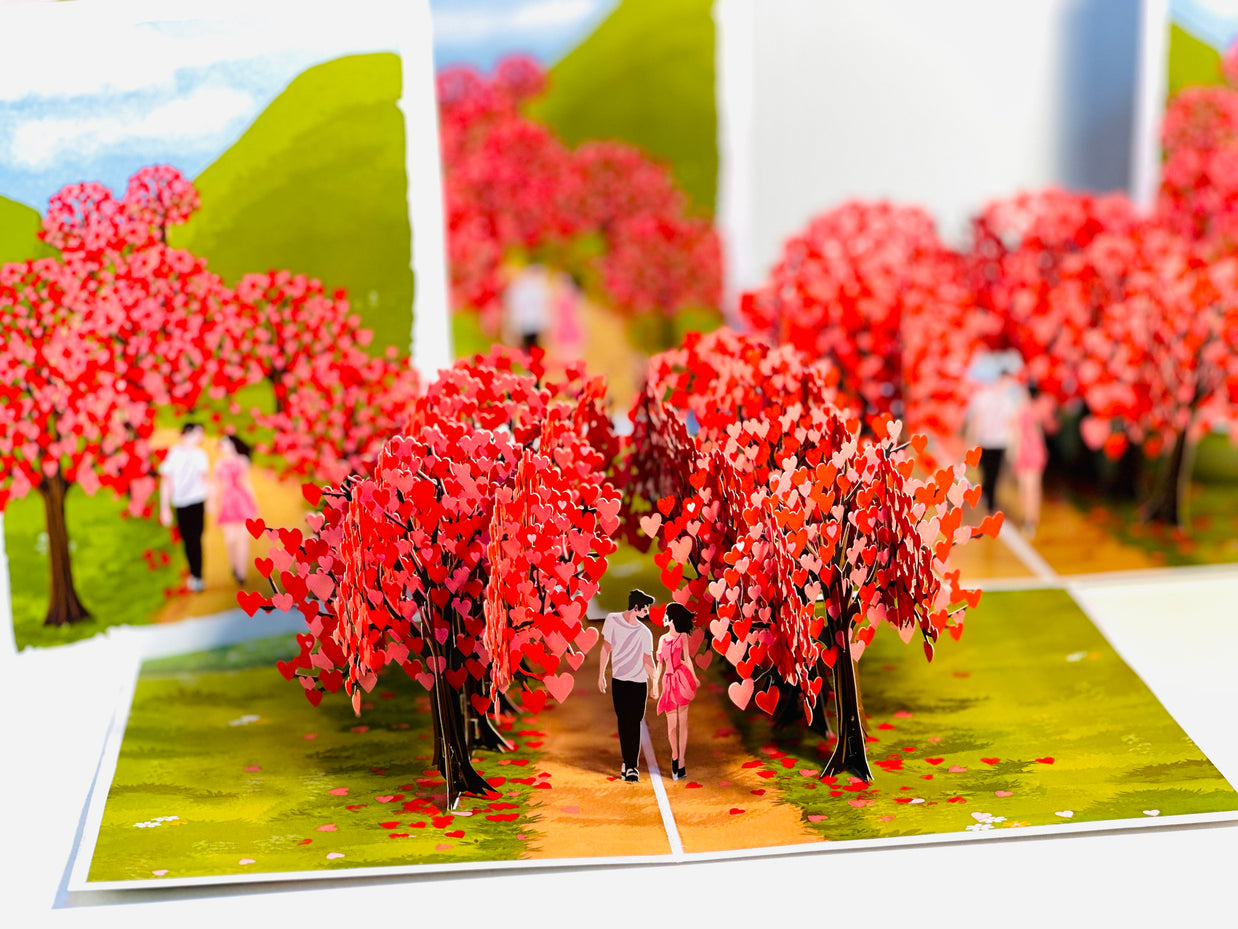 Love Heart Cherry Blossom Forest with a Couple in Love 3D POP UP GREETING CARD - Created by Origami Pop Cards Australian Design & Handmade 3D Pop Up Magical Paper Cards, Handmade Pop Up Cards Happy Valentine's Day Celebrate Love Heart Fell and Romantic