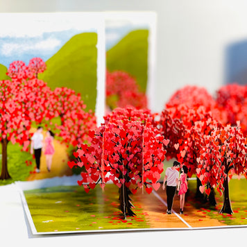 Love Heart Cherry Blossom Forest with a Couple in Love 3D POP UP GREETING CARD - Created by Origami Pop Cards Australian Design & Handmade 3D Pop Up Magical Paper Cards, Handmade Pop Up Cards Happy Valentine's Day Celebrate Love Heart Fell and Romantic
