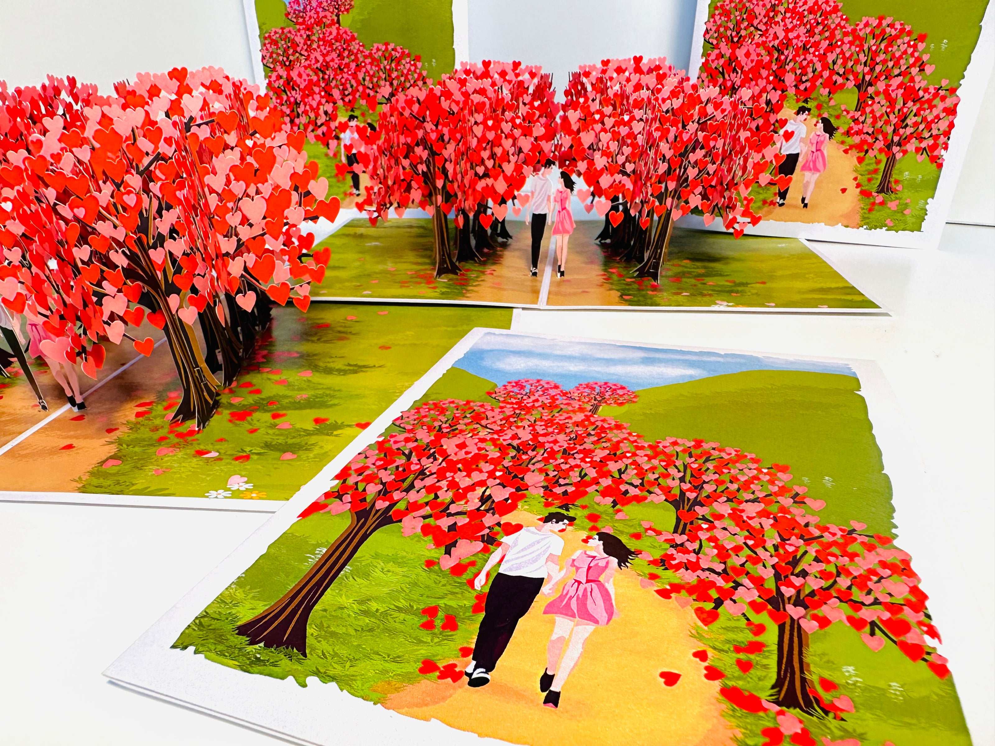 Love Heart Cherry Blossom Forest with a Couple in Love 3D POP UP GREETING CARD - Created by Origami Pop Cards Australian Design & Handmade 3D Pop Up Magical Paper Cards, Handmade Pop Up Cards Happy Valentine's Day Celebrate Love Heart Fell and Romantic