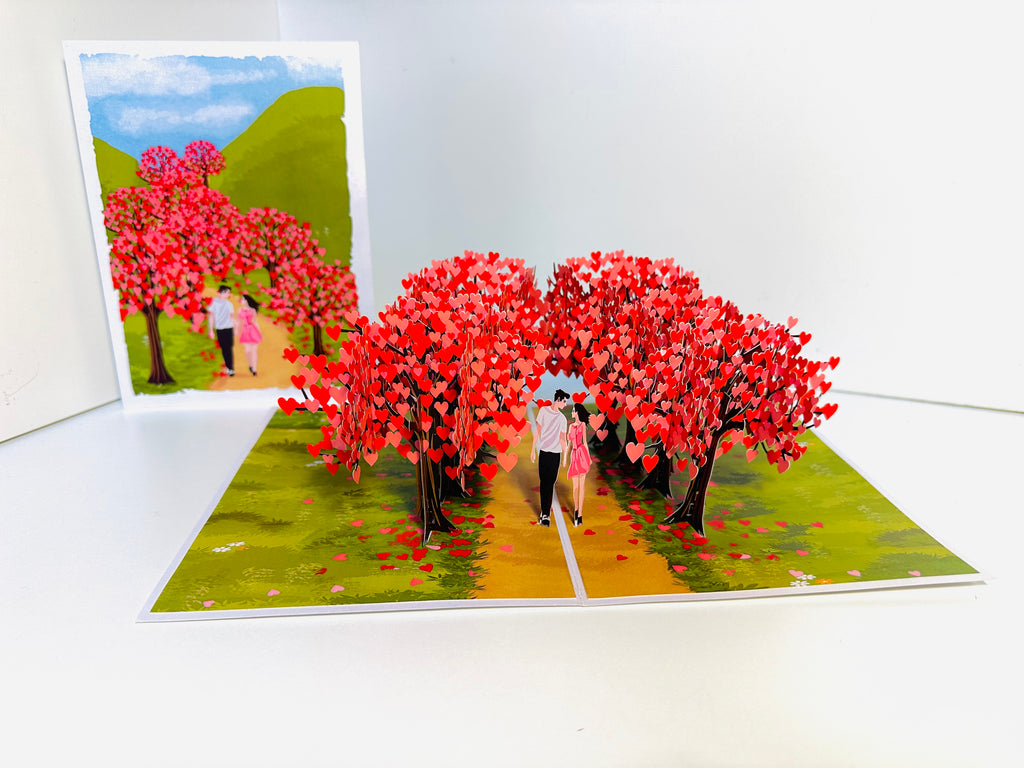 Love Heart Cherry Blossom Forest with a Couple in Love 3D POP UP GREETING CARD - Created by Origami Pop Cards Australian Design & Handmade 3D Pop Up Magical Paper Cards, Handmade Pop Up Cards Happy Valentine's Day Celebrate Love Heart Fell and Romantic