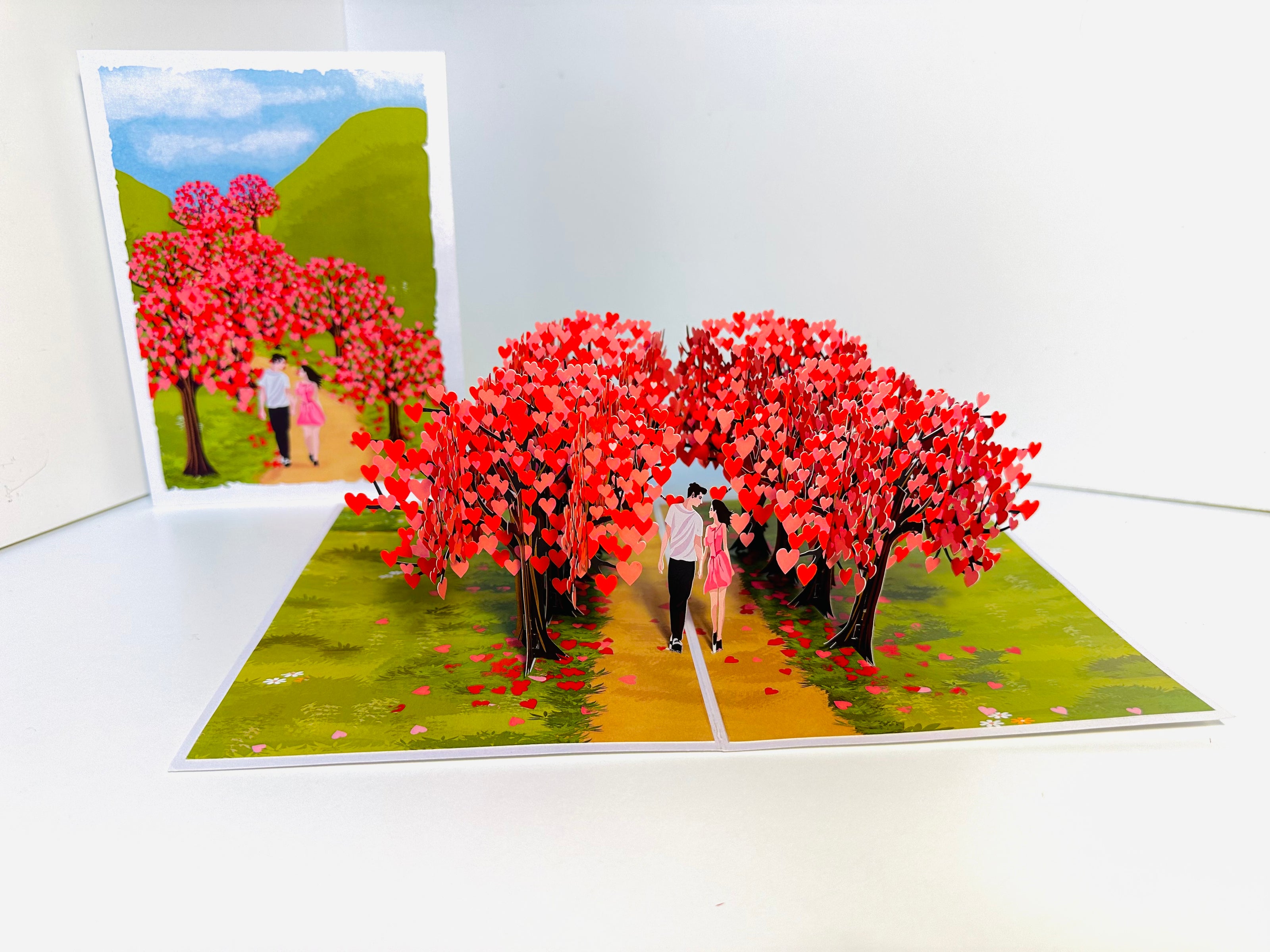 Love Heart Cherry Blossom Forest with a Couple in Love 3D POP UP GREETING CARD - Created by Origami Pop Cards Australian Design & Handmade 3D Pop Up Magical Paper Cards, Handmade Pop Up Cards Happy Valentine's Day Celebrate Love Heart Fell and Romantic