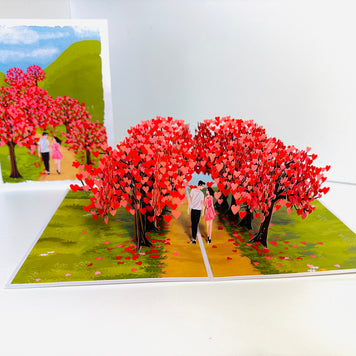 Love Heart Cherry Blossom Forest with a Couple in Love 3D POP UP GREETING CARD - Created by Origami Pop Cards Australian Design & Handmade 3D Pop Up Magical Paper Cards, Handmade Pop Up Cards Happy Valentine's Day Celebrate Love Heart Fell and Romantic