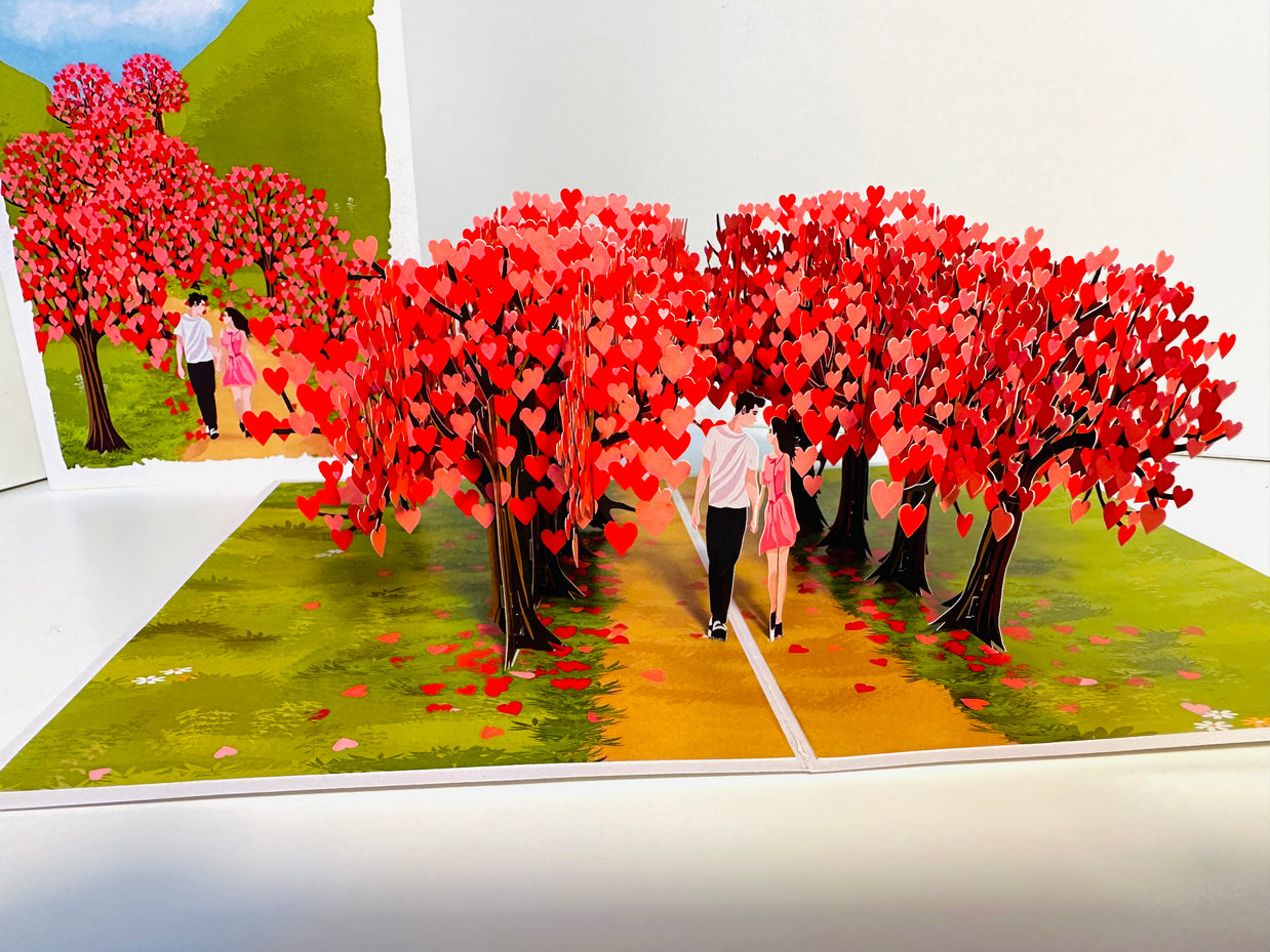 Love Heart Cherry Blossom Forest with a Couple in Love 3D POP UP GREETING CARD - Created by Origami Pop Cards Australian Design & Handmade 3D Pop Up Magical Paper Cards, Handmade Pop Up Cards Happy Valentine's Day Celebrate Love Heart Fell and Romantic