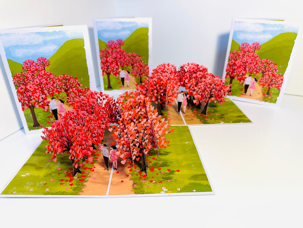 Love Heart Cherry Blossom Forest with a Couple in Love 3D POP UP GREETING CARD - Created by Origami Pop Cards Australian Design & Handmade 3D Pop Up Magical Paper Cards, Handmade Pop Up Cards Happy Valentine's Day Celebrate Love Heart Fell and Romantic