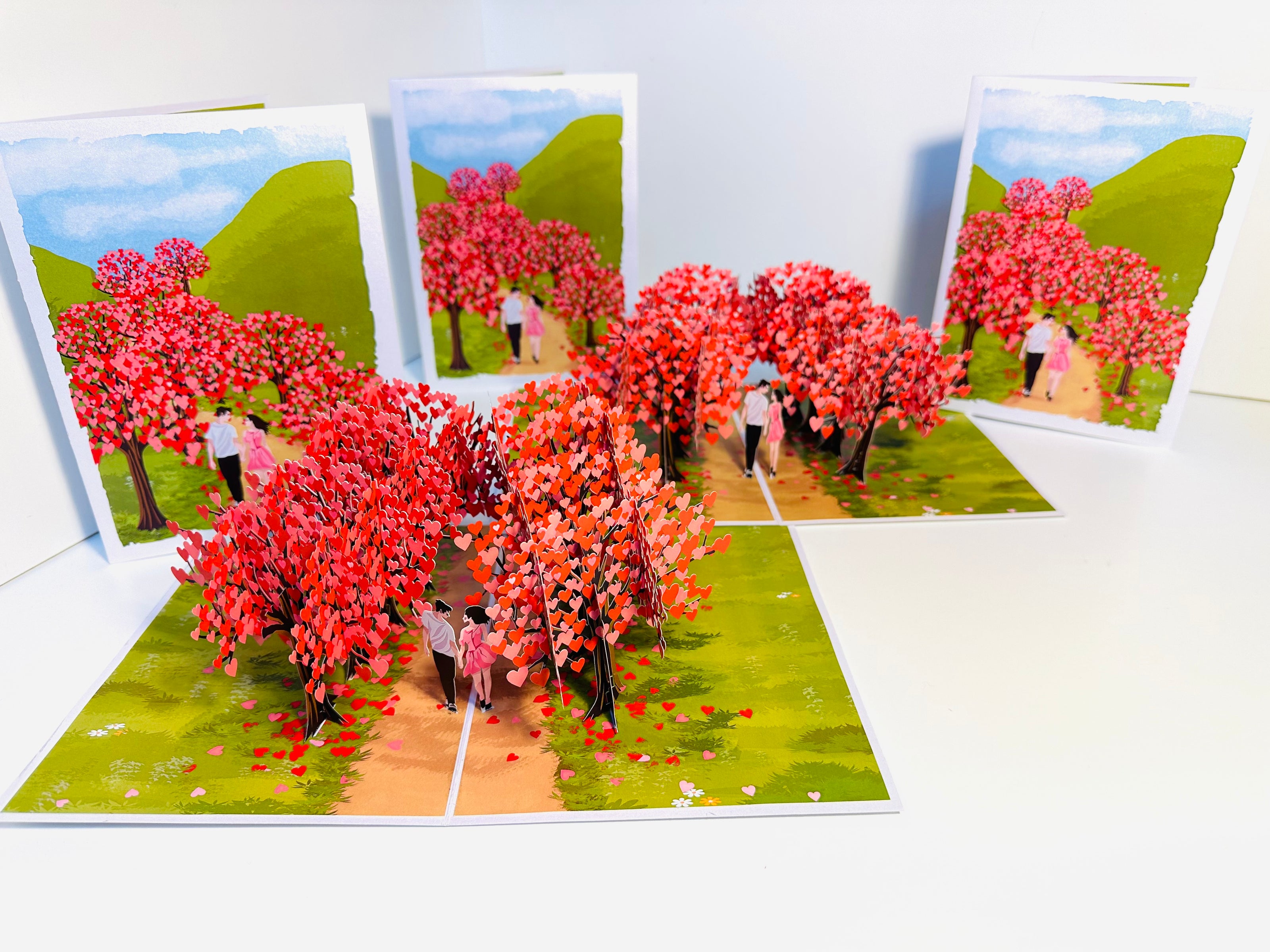 Love Heart Cherry Blossom Forest with a Couple in Love 3D POP UP GREETING CARD - Created by Origami Pop Cards Australian Design & Handmade 3D Pop Up Magical Paper Cards, Handmade Pop Up Cards Happy Valentine's Day Celebrate Love Heart Fell and Romantic