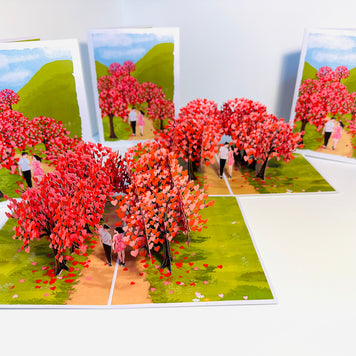 Love Heart Cherry Blossom Forest with a Couple in Love 3D POP UP GREETING CARD - Created by Origami Pop Cards Australian Design & Handmade 3D Pop Up Magical Paper Cards, Handmade Pop Up Cards Happy Valentine's Day Celebrate Love Heart Fell and Romantic