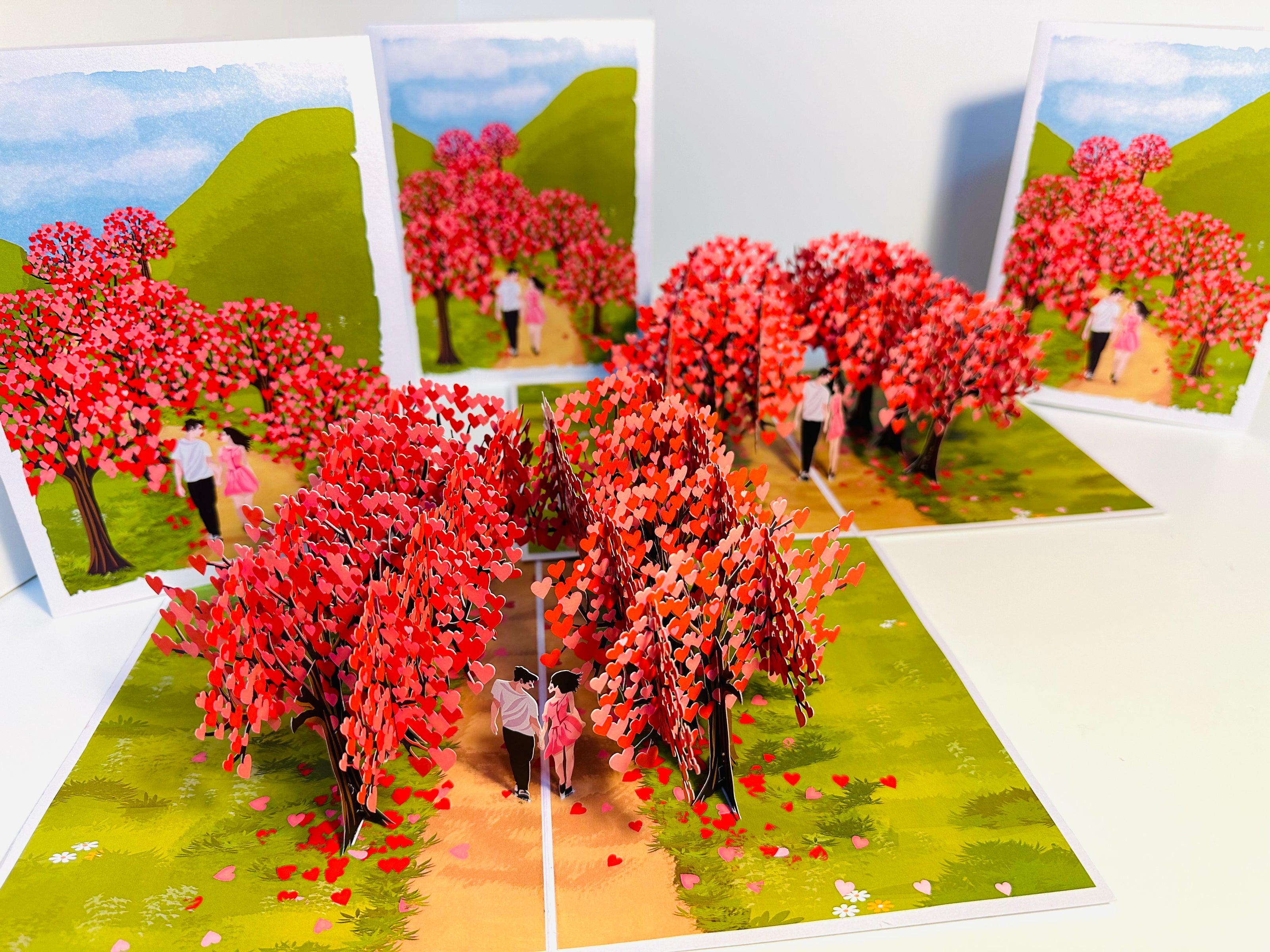 Love Heart Cherry Blossom Forest with a Couple in Love 3D POP UP GREETING CARD - Created by Origami Pop Cards Australian Design & Handmade 3D Pop Up Magical Paper Cards, Handmade Pop Up Cards Happy Valentine's Day Celebrate Love Heart Fell and Romantic